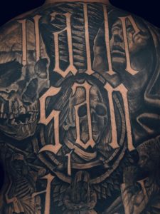 Cover Up Tattoo of script text by Legendary Tattoos in Las Vegas.