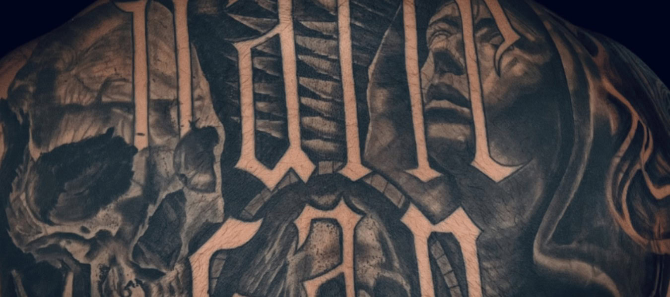 Cover Up Tattoo of script text by Legendary Tattoos in Las Vegas.