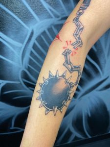Spiked Chain Ball Tattoo By Legendary Tattoos in Las Vegas Nevada.