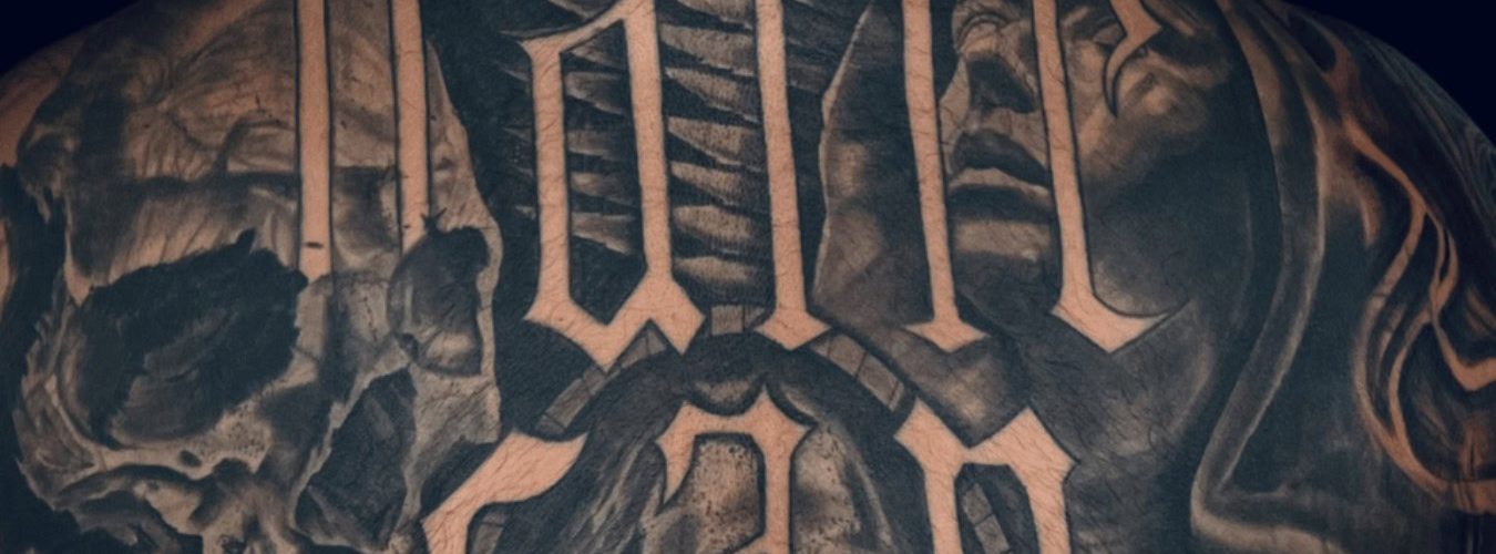 Cover Up Tattoo of script text by Legendary Tattoos in Las Vegas.