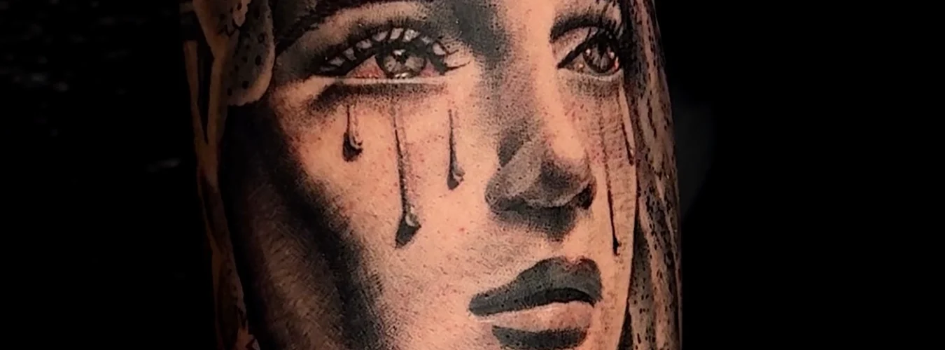 Black and Grey Tattoos by Legendary Tattoos Mother Mary crying black and grey realism tattoos by Legendary Tattoos in Las Vegas.