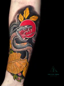Colored Neotraditional snake tattoo by Legendary Tattoos in Las Vegas.
